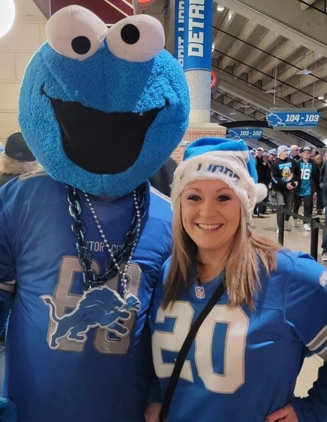 Ms. Bales posing in her Lions wear.