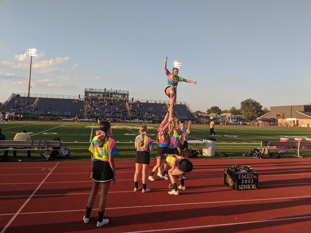 varsity cheer team working on stunts.